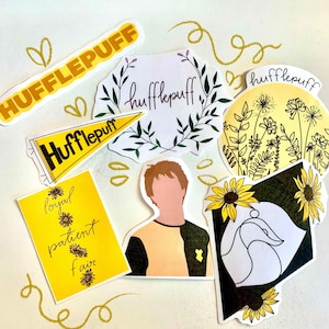 May include: A collection of yellow and black stickers with the word "Hufflepuff" and related imagery. Designs include a pennant, floral arrangements, and a badger. Some stickers feature the words "loyal, patient, fair."