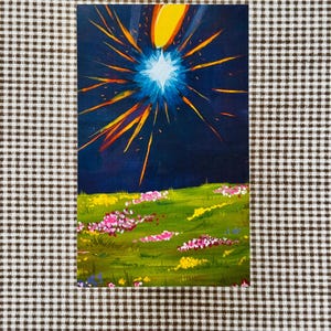 May include: An original painting depicting a celestial event. A bright blue starburst with yellow and orange rays dominates a dark blue sky. The foreground features a green field with pink and yellow flowers.