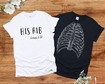 May include: Two t-shirts, one white and one black. The white t-shirt has the text "HIS RIB Genesis 2:22" printed on it. The black t-shirt has a graphic of a ribcage printed on it.