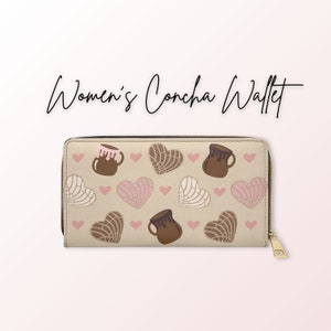 May include: A beige zippered wallet with a pattern of brown concha bread and chocolate milk jugs. The pattern is repeated on the front of the wallet.
