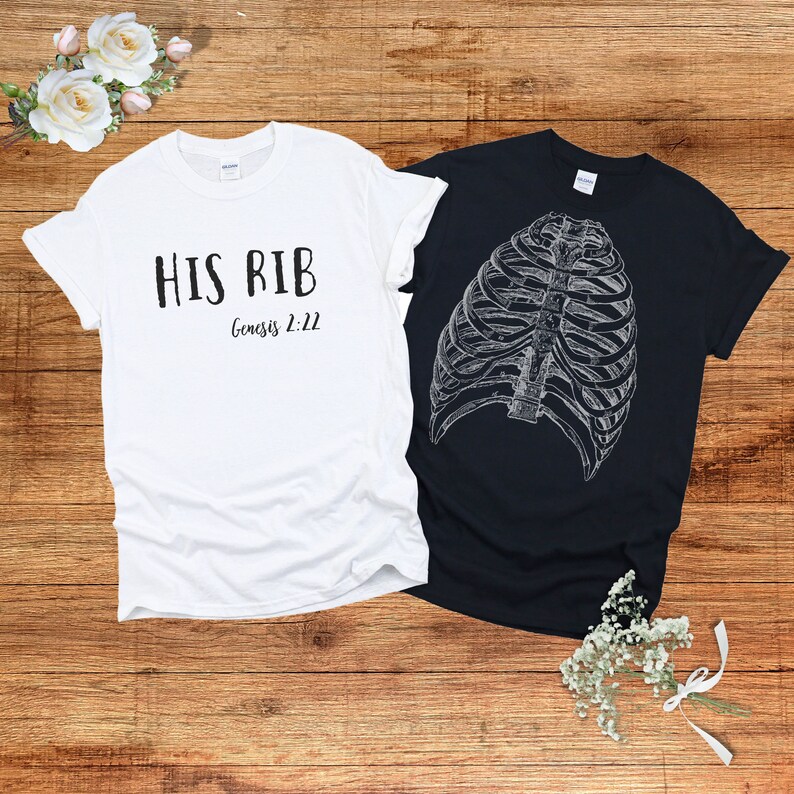 May include: Two t-shirts, one white and one black. The white t-shirt has the text "HIS RIB Genesis 2:22" printed on it. The black t-shirt has a graphic of a ribcage printed on it.