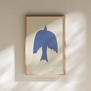 May include: A framed print featuring a blue bird silhouette and the text "If the Son sets you free, you will be free indeed" John 8:36. The print has a light beige background and a wooden frame.