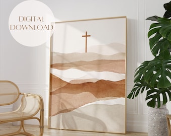 May include: Digital download of a watercolour painting featuring a brown cross on a background of abstract brown and beige hills.