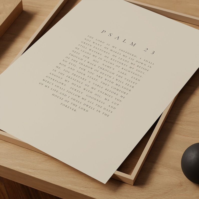 May include: A beige printable wall art print with the text "PSALM 23" and a poem about the Lord being a shepherd. The text is in a simple black font.