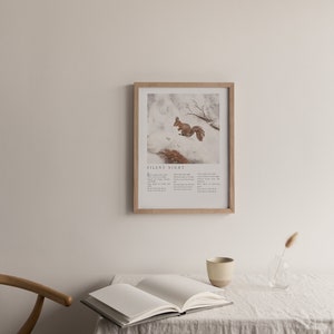 May include: A framed print with a watercolor illustration of a squirrel in a snowy forest. The print includes the lyrics to the Christmas carol "Silent Night".