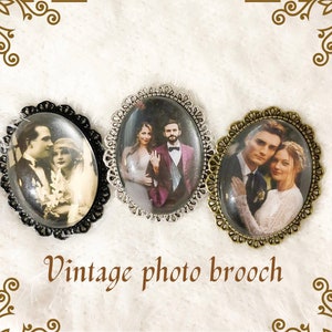 May include: Three vintage photo brooches with oval glass inserts. The brooches feature photos of couples in black and white and colour. The brooches are silver, gold, and black.