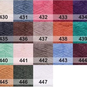 May include: A color chart of yarn samples, numbered 430 to 447. The yarn samples are arranged in rows of six, with each sample showing a different color.