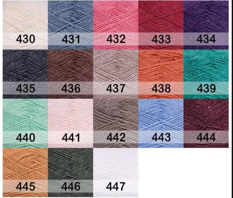 May include: A color chart of yarn samples, numbered 430 to 447. The yarn samples are arranged in rows of six, with each sample showing a different color.