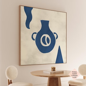 May include: Abstract art print in a wooden frame. It features a blue vase shape with handles and an oval design, plus other blue shapes, on a beige background. The artwork is framed.