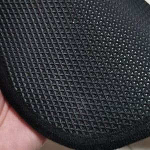 May include: Black rubber mat with a textured diamond pattern and a black fabric border.