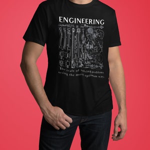 May include: Black t-shirt with a white graphic design of various engineering tools and the text "ENGINEERING The craft of solving problems using the most optimum way."
