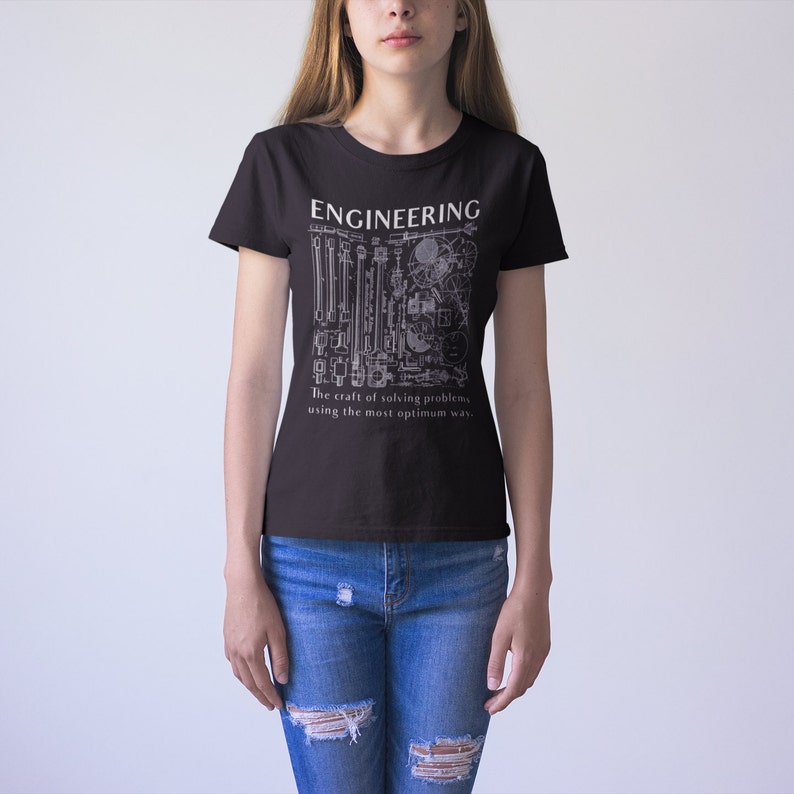 May include: A black t-shirt with a white graphic design of a blueprint with the text "ENGINEERING The craft of solving problems, using the most optimum way."