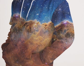 May include: A blue and brown hoodie with a galaxy print. The hoodie has a drawstring hood and a kangaroo pocket.