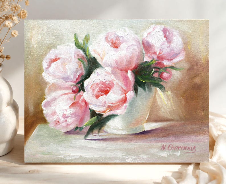 Peonies oil painting of a bouquet of pink peonies in a white vase. The flowers have multiple layers of petals and green leaves. The background is a soft, neutral color. The painting is signed "N. Chernous" in the bottom right corner.