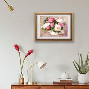 Peony oil painting original of a bouquet of peonies in a round white vase. The flowers are a mix of white and pink, with green leaves. The background is light and warm.