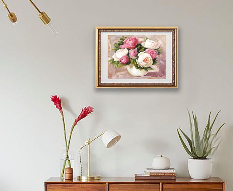 Peony oil painting original of a bouquet of peonies in a round white vase. The flowers are a mix of white and pink, with green leaves. The background is light and warm.