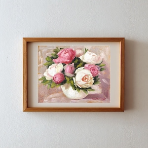 Peony oil painting original of a bouquet of peonies in a round white vase. The flowers are a mix of white and pink, with green leaves. The background is light and warm. The artist's signature is in the bottom right corner.