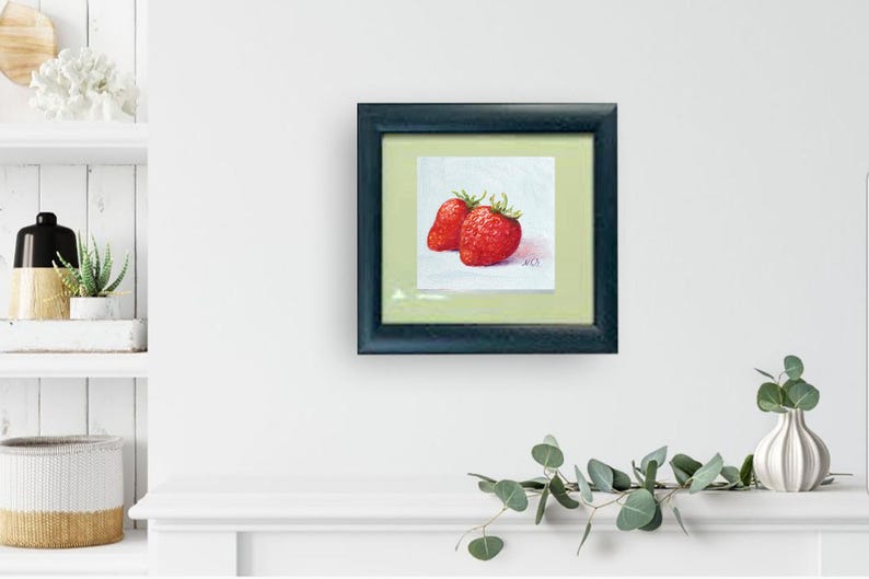 Strawberry painting. Original oil painting on cardboard of two red strawberries on a light blue background.