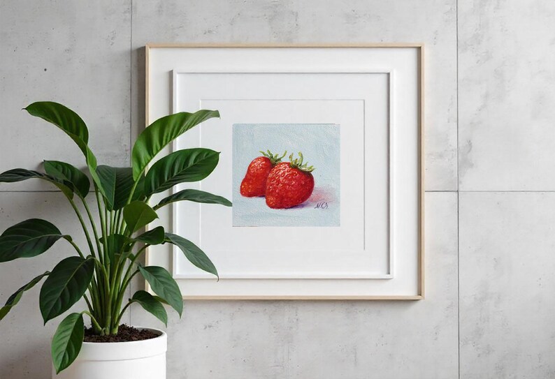 Strawberry oil painting. Original oil painting on cardboard of two red strawberries on a light blue background.