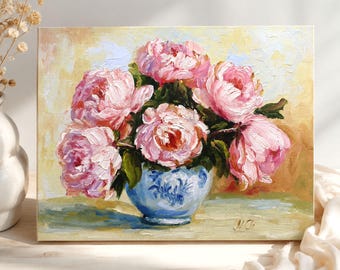 May include: An oil painting on canvas depicting a bouquet of pink peonies in a blue and white patterned ceramic vase. The artwork features thick, textured brushstrokes against a soft yellow and cream background, with the artist's signature N.Ch.