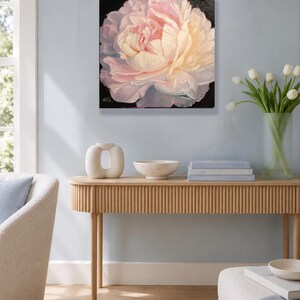 Peony oil painting. A close-up of a single, pale pink peony flower with a white center. The flower is painted in a realistic style with visible brushstrokes. The background is black. Signature of artist