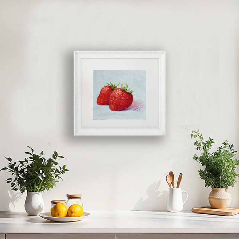 Strawberry painting. Original oil painting on cardboard of two red strawberries on a light blue background.
