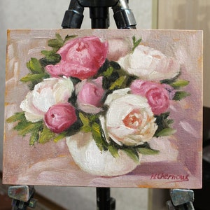 Peony oil painting of a bouquet of pink and white peonies in a white vase. The flowers are arranged in a loose, natural style, and the background is a soft, muted pink.