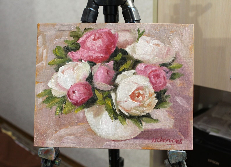 Peony oil painting of a bouquet of pink and white peonies in a white vase. The flowers are arranged in a loose, natural style, and the background is a soft, muted pink.