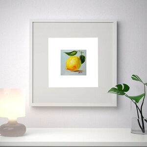Lemon oil painting. A painting of a single yellow lemon with green leaves on a light blue background. The painting is signed in the bottom right corner.