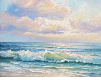 May include: An oil painting depicts a serene seascape. The artwork features a light blue sky with fluffy, pastel-colored clouds. Turquoise waves crash onto a sandy shore, creating a tranquil coastal scene.