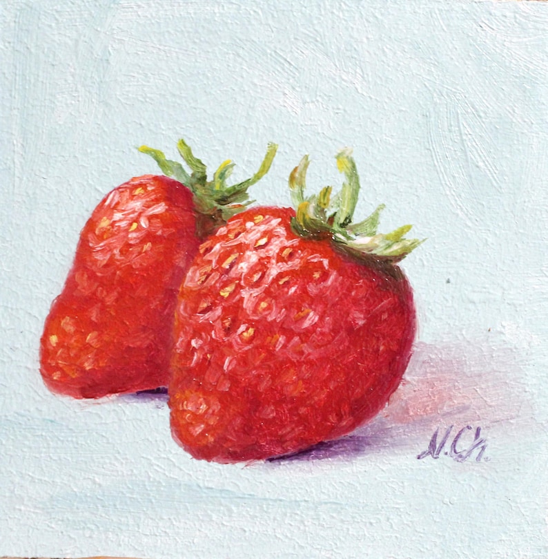 Strawberry oil painting. Original oil painting on cardboard of two red strawberries on a light blue background.