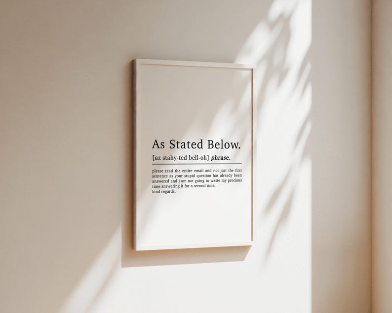 May include: A white framed print with black text that reads "As Stated Below."  The text is defined as a phrase and includes the phonetic pronunciation. The text continues with a humorous message about an email and a request to read the entire email before responding.