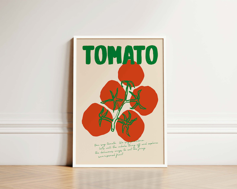 May include: A white framed poster with the word "TOMATO" in green letters. The poster features a red tomato vine with green leaves and five red tomatoes.