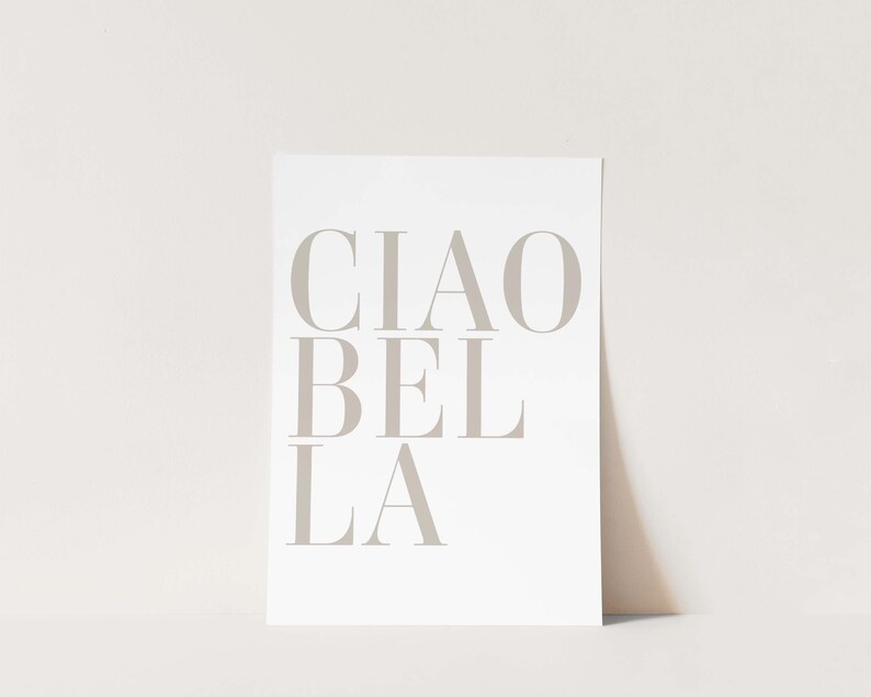 May include: A white print with the text "CIAO BEL LA" in a light gray color.