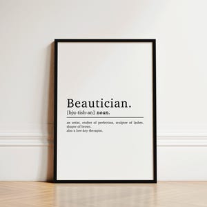 May include: A black and white printable definition of the word "Beautician" with the phonetic pronunciation and a description of the profession. The text reads: "Beautician. [bju-tish-an] noun. an artist, crafter of perfection, sculptor of lashes, shaper of brows. also a low-key therapist."