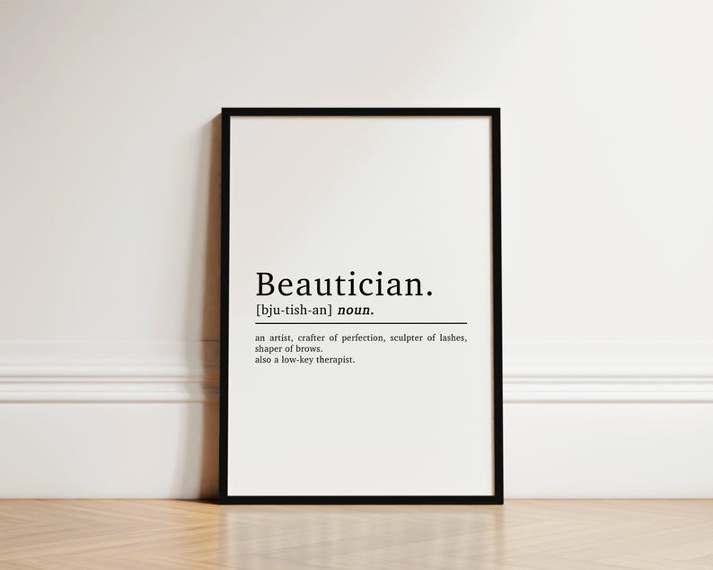 May include: A black and white printable definition of the word "Beautician" with the phonetic pronunciation and a description of the profession. The text reads: "Beautician. [bju-tish-an] noun. an artist, crafter of perfection, sculptor of lashes, shaper of brows. also a low-key therapist."