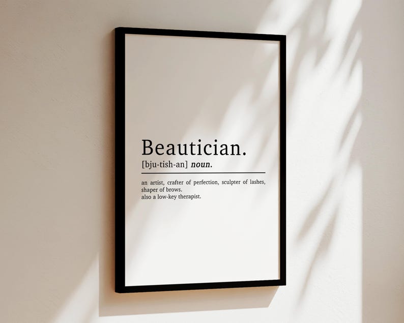 May include: A black and white printable wall art print with the definition of the word "Beautician". The definition reads: "an artist, crafter of perfection, sculptor of lashes, shaper of brows. also a low-key therapist."
