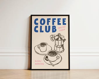 May include: A black framed poster with a beige background. The text "COFFEE CLUB" is in blue with the words "SERVED FRESH" in pink below. A black and white illustration of a coffee pot, a cup of coffee, and a saucer is on the poster. The text "EVERY MORNING" is in pink at the bottom of the poster.