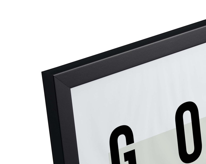 May include: Black picture frame with a white mat and the word "GOOD" printed in black.