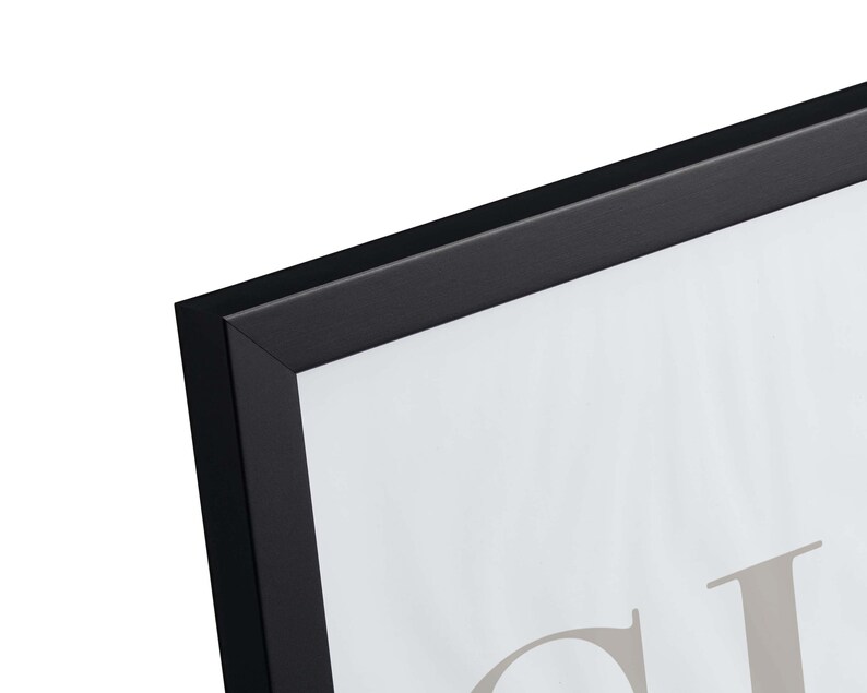 May include: Black picture frame with a white mat and a blank white space for a photo or artwork. The frame is made of wood and has a simple, modern design.