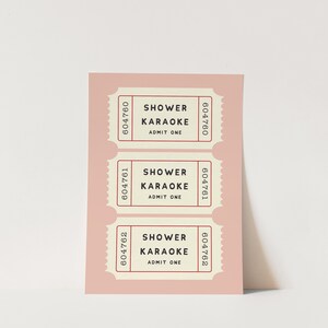 May include: A blush pink card with three retro-style tickets. Each ticket reads "SHOWER KARAOKE ADMIT ONE" in a serif font. The tickets have a cream-colored background and a red border with a unique serial number.