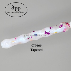 May include: A white tapered pen with pink and purple accents. The pen has a swirling design and the text "CT666 Tapered". The pen is from blanksbydpp.com.