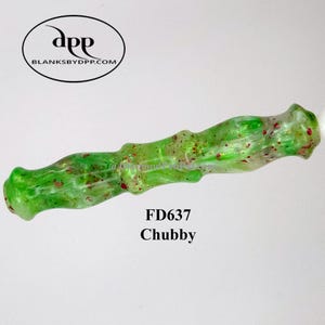 May include: A green and clear resin pen blank with red glitter accents. The pen blank is labeled "FD637 Chubby" and has a textured, organic shape. The logo for blanksbydpp.com is in the upper left corner.