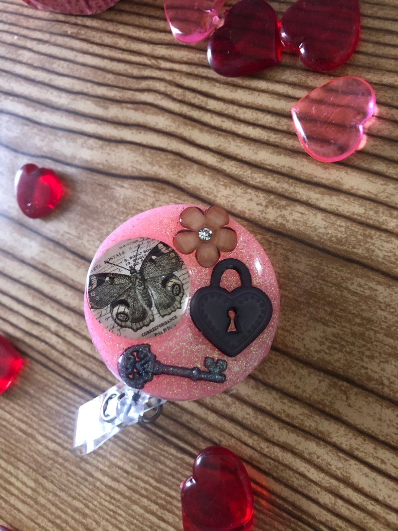 Resin butterfly lock and key badge real