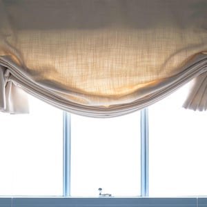 Made to measure Relaxed London Roman Blinds made in the Uk handfinished with your bespoke finish lined or unlined in a fabric of your choice