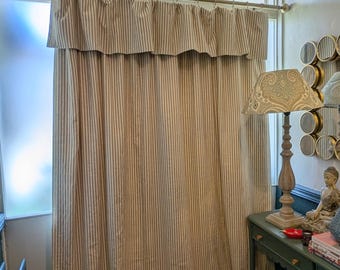 Back in stock our ready made door curtain, large flop over neutral ticking stripe cotton mix fabric, black out lined handfinished in the UK