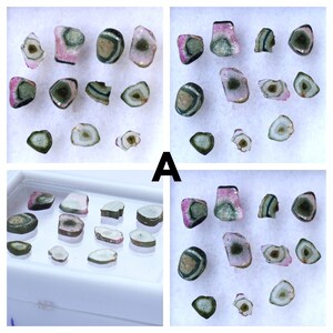 May include: A collection of watermelon tourmaline gemstones, displaying pink, green, and clear hues. The stones are cut and polished, revealing concentric patterns. The letter "A" is visible in the image.