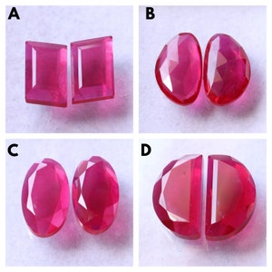 May include: Four pairs of ruby gemstones, labeled A through D. Each pair is arranged side-by-side, showcasing different cuts and shapes.
