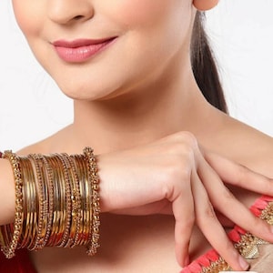 Gold metal bangles set hotsell