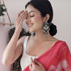 Long earrings with saree deals
